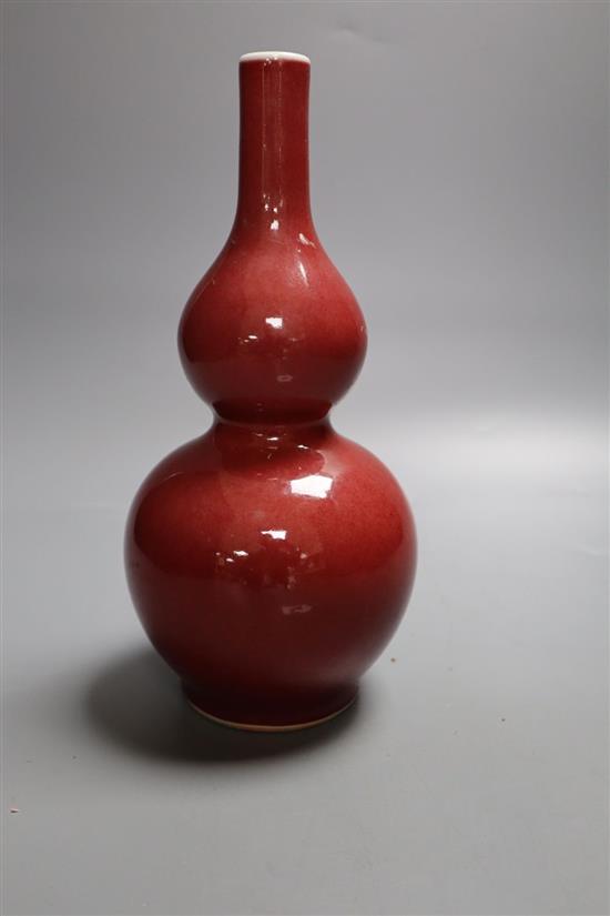 A Chinese sang-de-boeuf glazed double gourd vase, height 23cm